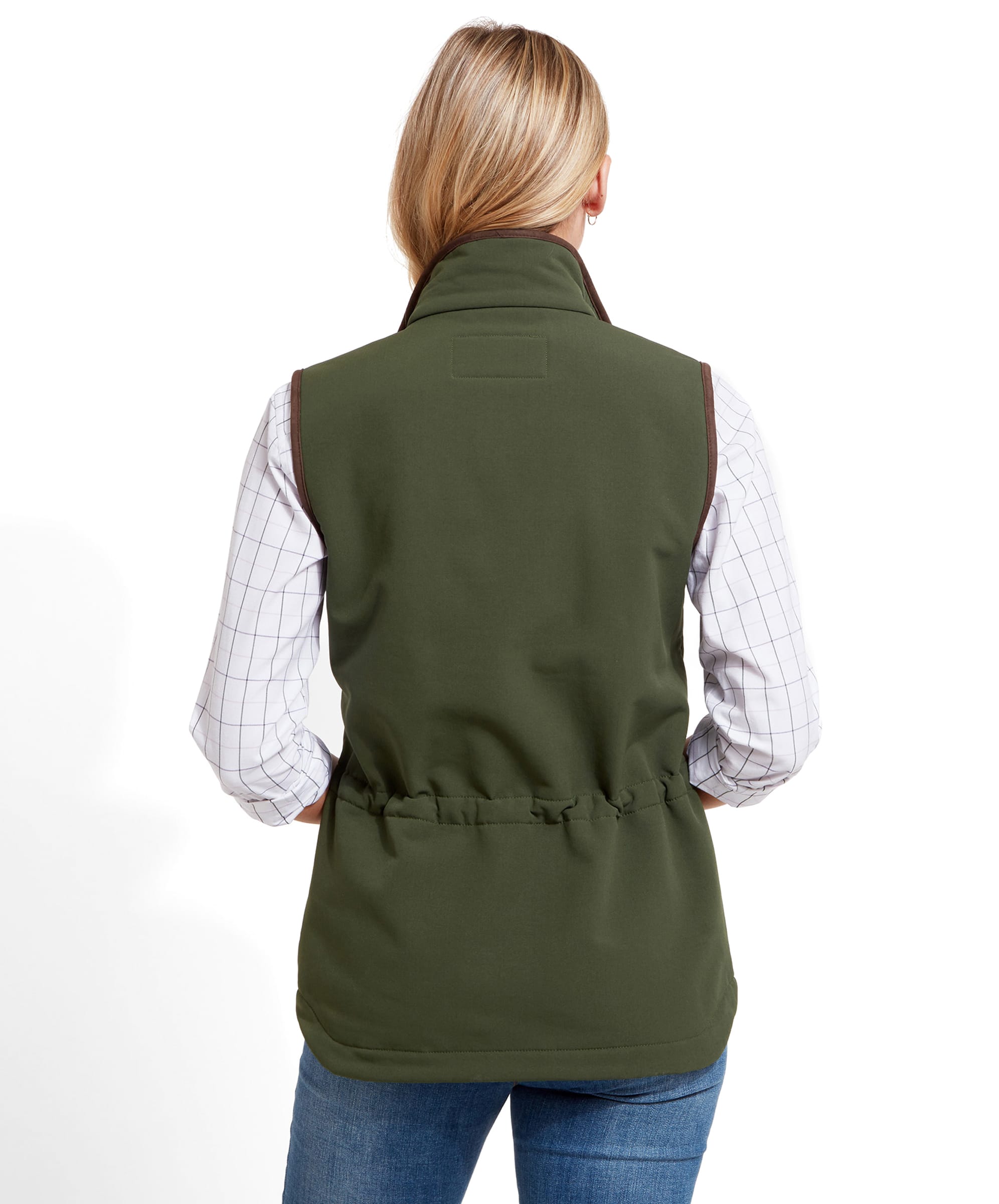 Back view of the woman wearing a Schöffel Belton Gilet for Women in Green over a checkered shirt. The gilet has a cinched waist detail.