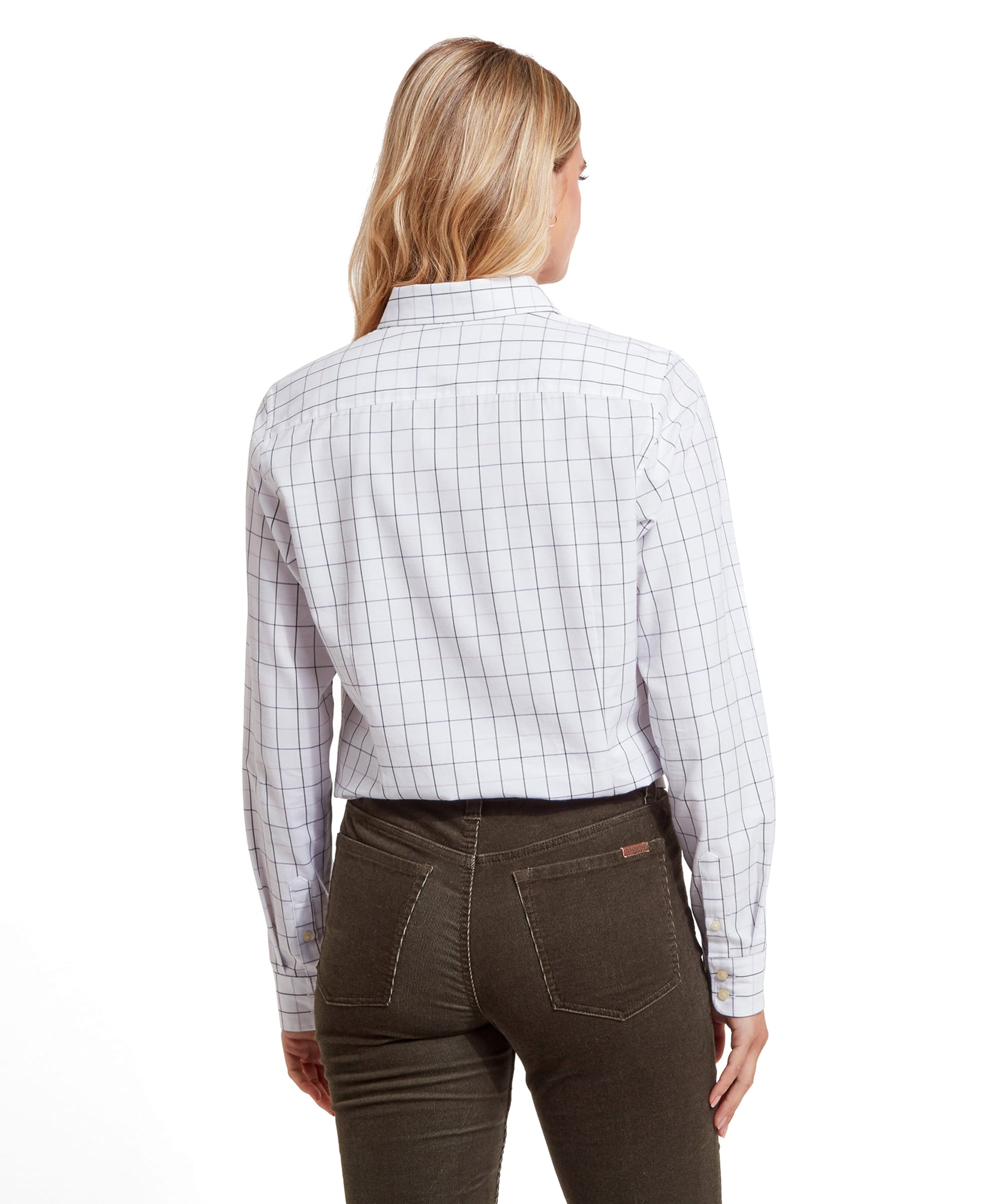 Rear view of the woman showcasing the back of the Schöffel Blakeney Shirt for Womens in Purple, paired with dark brown trousers, highlighting the shirt's fit.