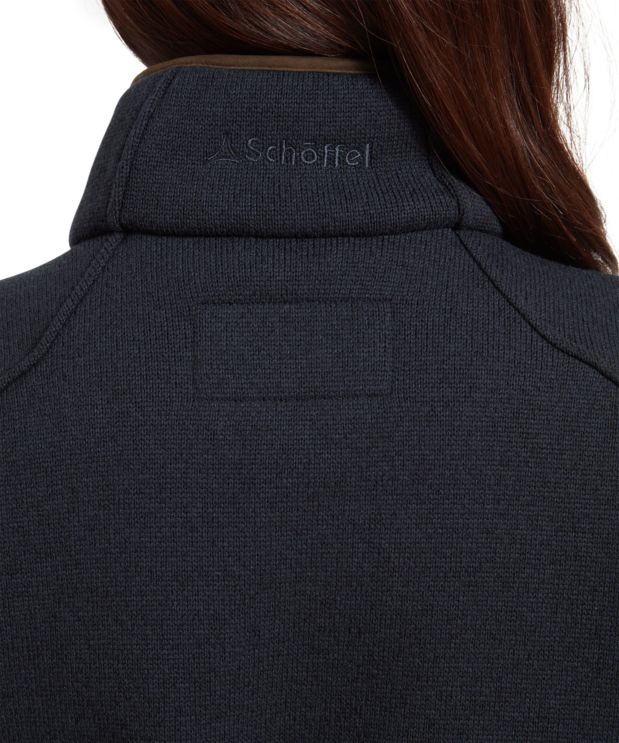 Close-up of the back collar of the Schöffel Burley Hybrid Jacket for Women in Blue, showing the Schöffel logo.