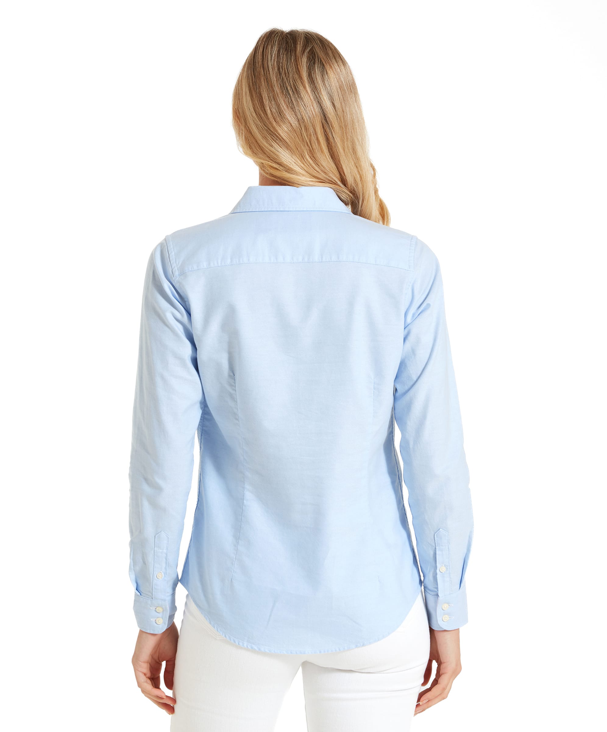 Back view of the woman standing, showcasing the Schöffel Cley Women's Soft Oxford Shirt for Womens in Light Bluefrom behind.