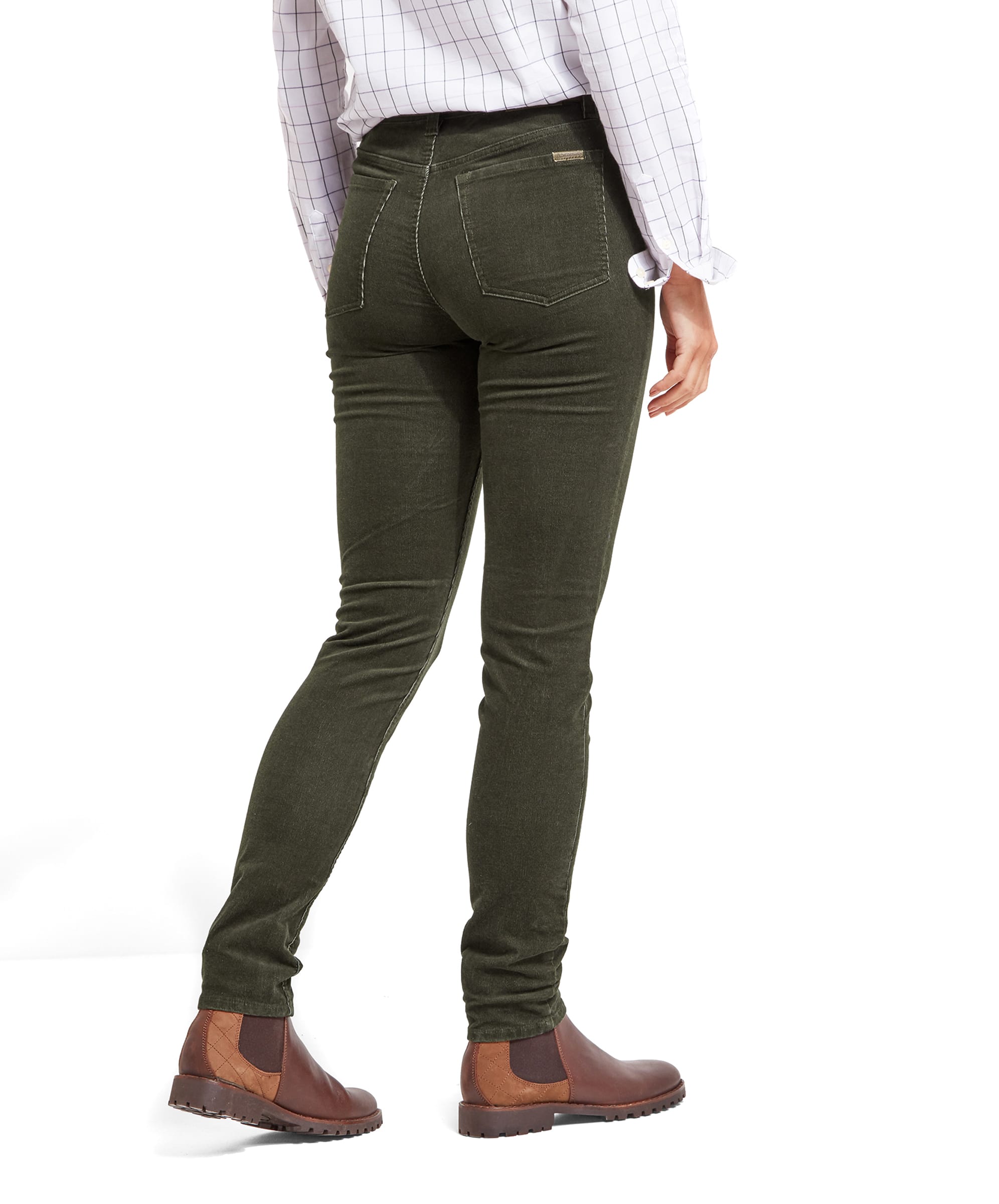 Rear view of a model showcasing the fit of Schöffel Clover Cord Jean for Womens in Green with a high waist and a classic five-pocket design. The jeans are paired with a white checked shirt and brown Chelsea boots.