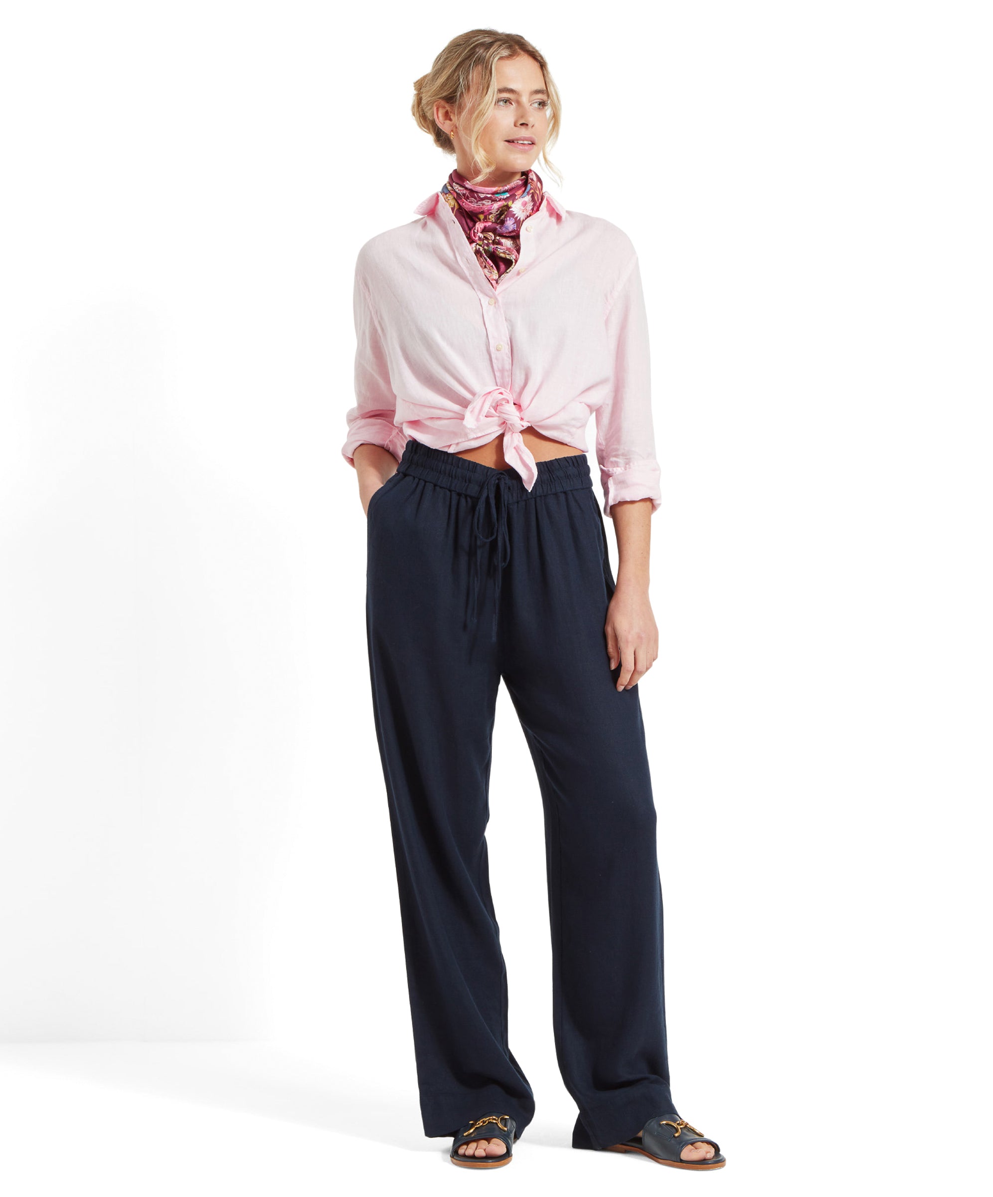 Another full body shot of Schöffel Women's Daphne Trousers in navy, showing the outfit styled with a pink shirt and neck scarf.