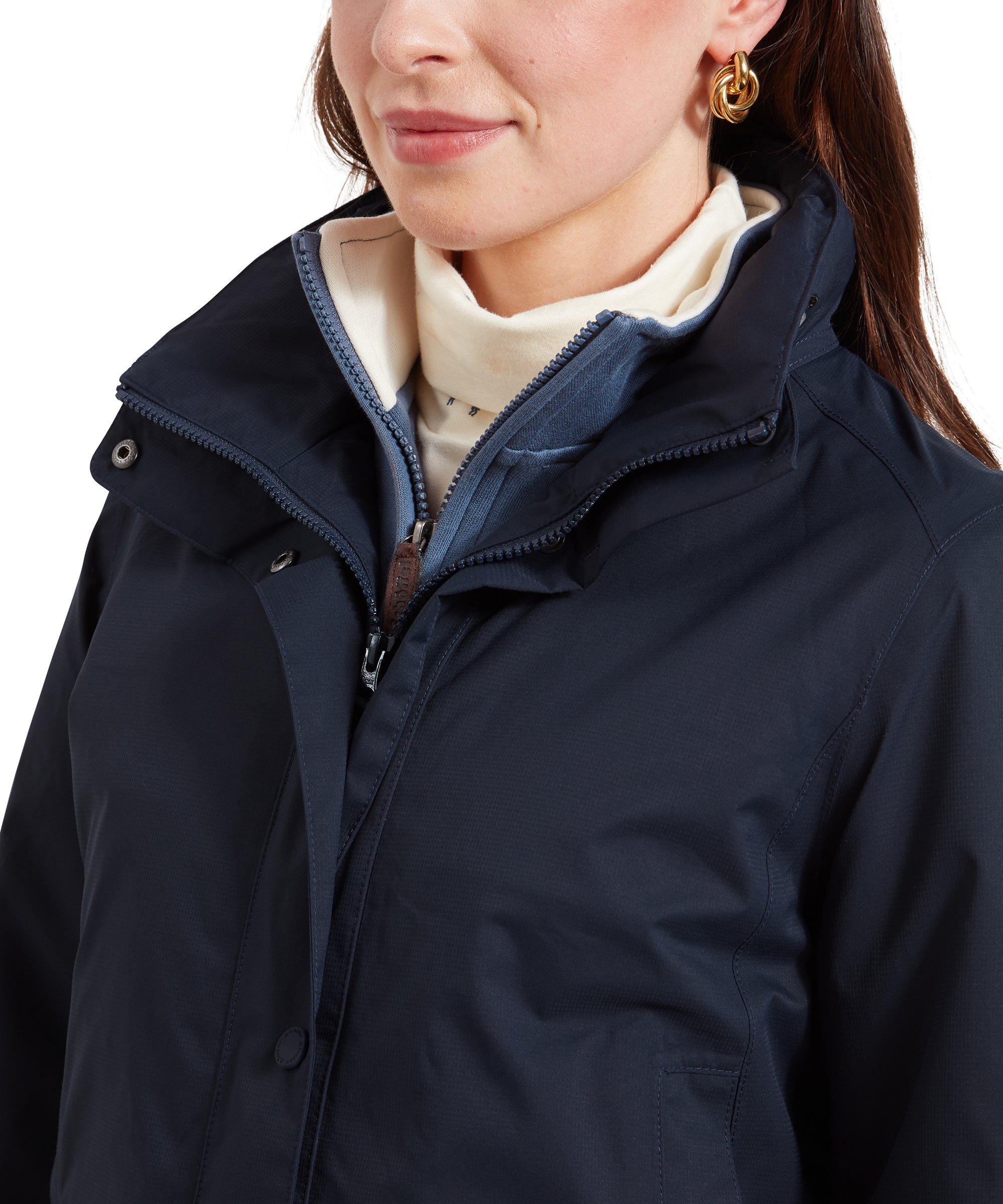 A close-up of the collar area of a Schöffel Edith Jacket for Women in Blue, showing the zip and button closure, along with the high collar design.