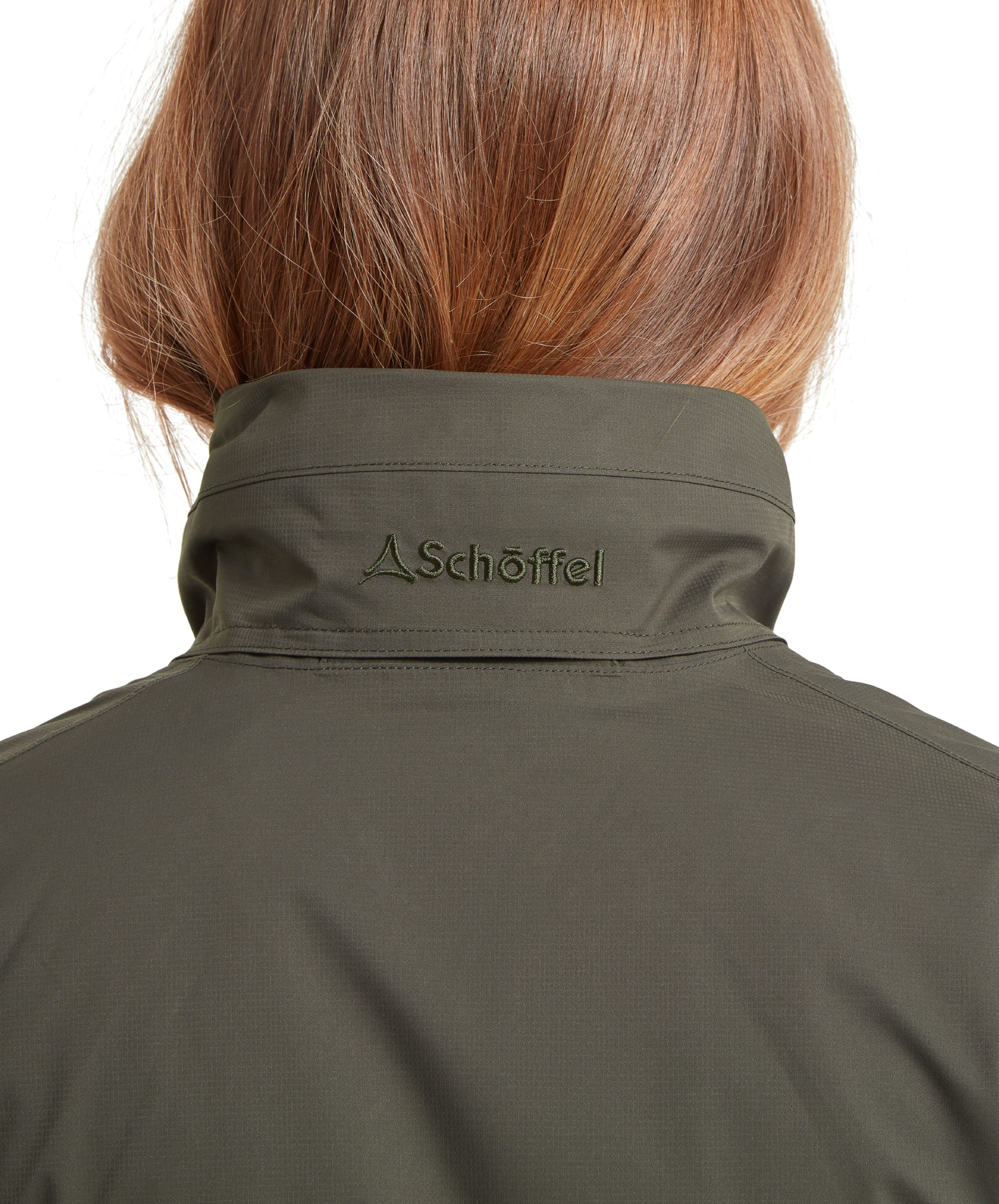 The back view of the Schöffel Edith Jacket for Women in Green, highlighting the embroidered Schöffel logo on the collar.