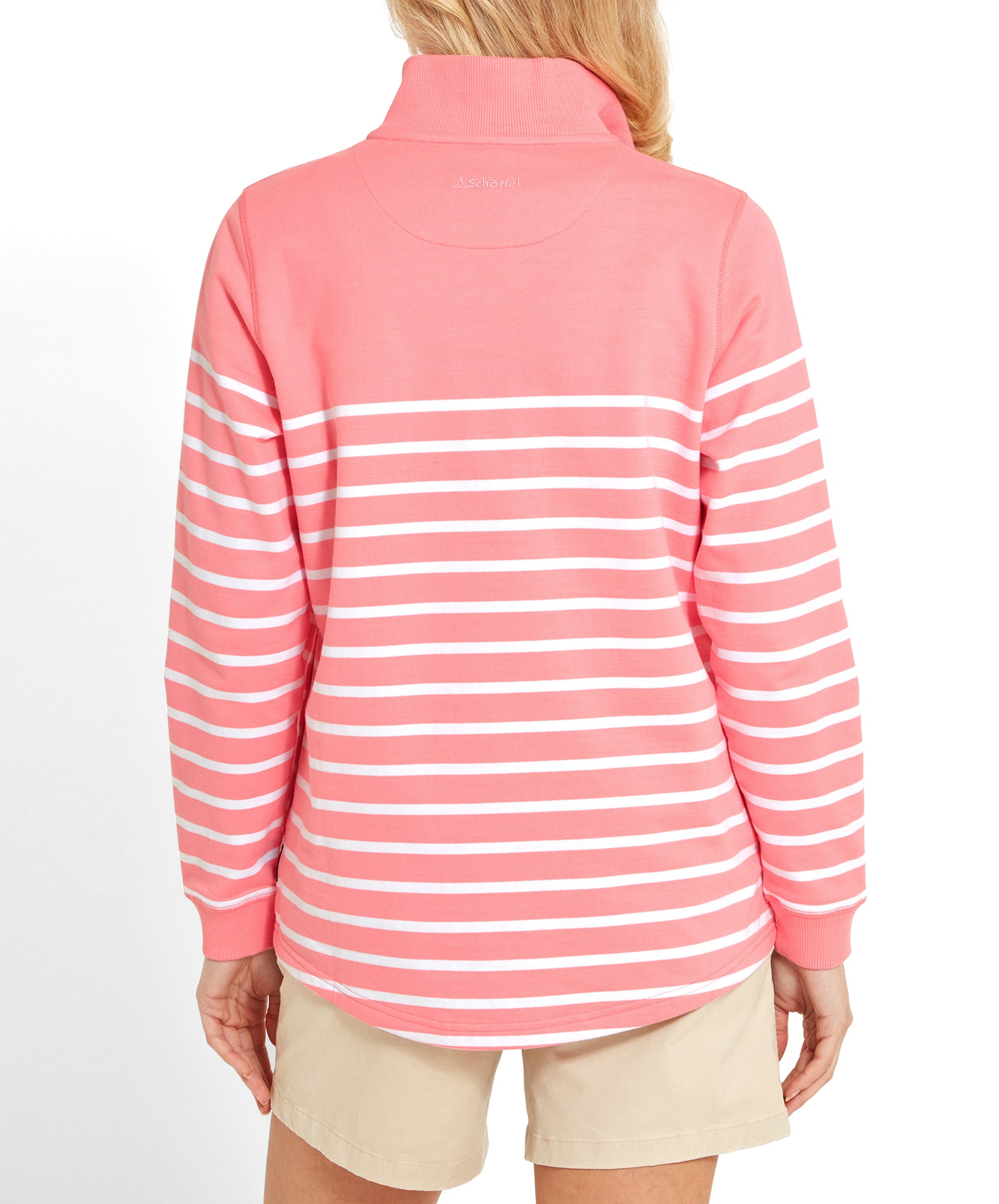 Back view of a woman in a Schöffel Hope Cove Sweatshirt for Women in Pinkand beige shorts, showing the full back design.