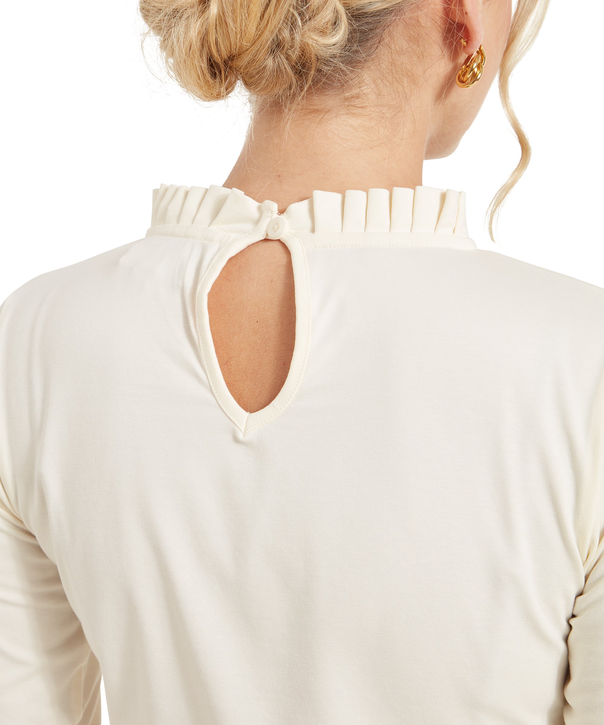 Close-up view of the back of the Schöffel Ilkley Top for Women in Cream, highlighting the keyhole cutout and pleated neckline.