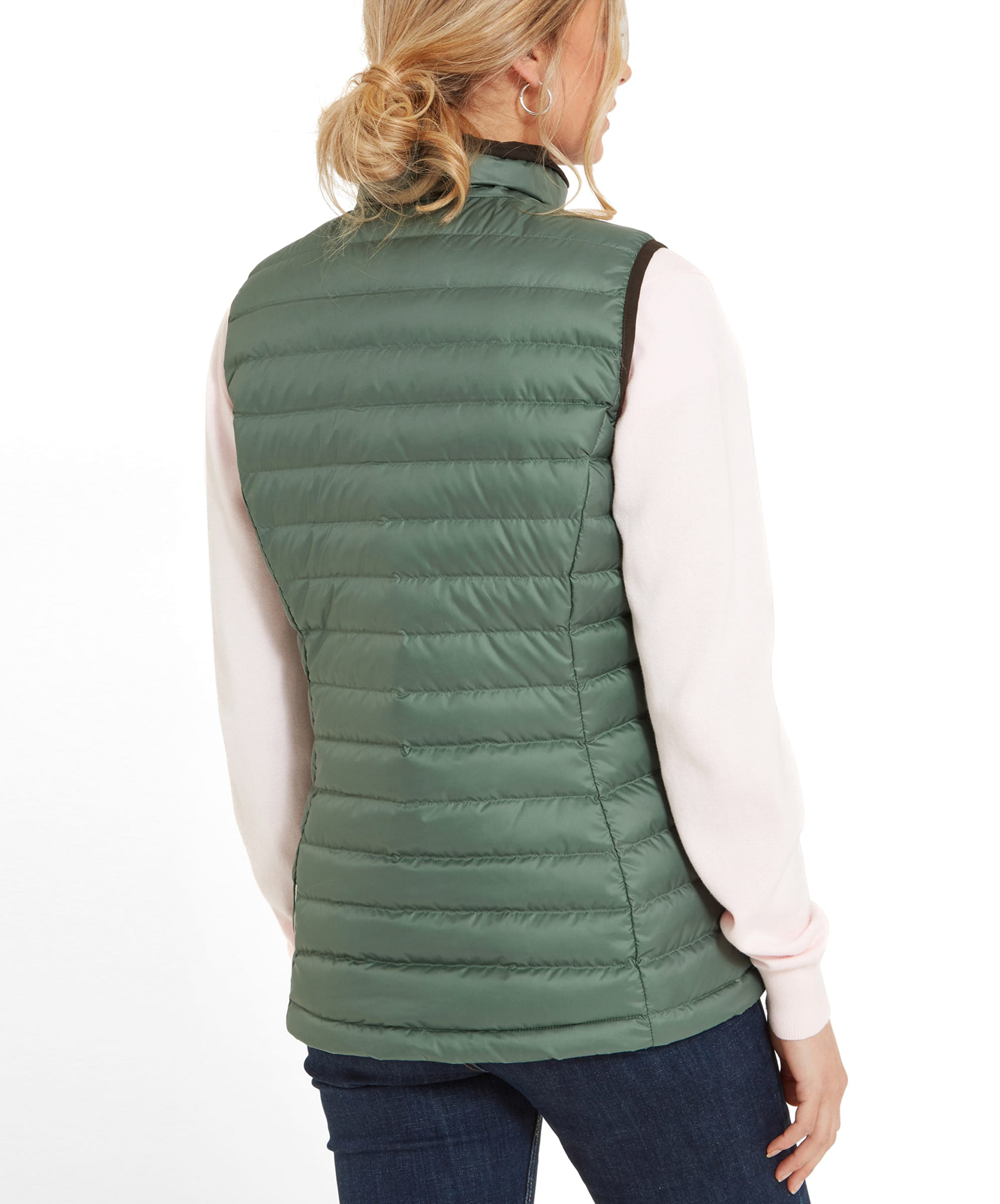 A rear view of the Schöffel Launde Down Gilet for Women in Green highlighting the ribbed detail and suedette trims. The model wears her blonde hair in a loose bun.