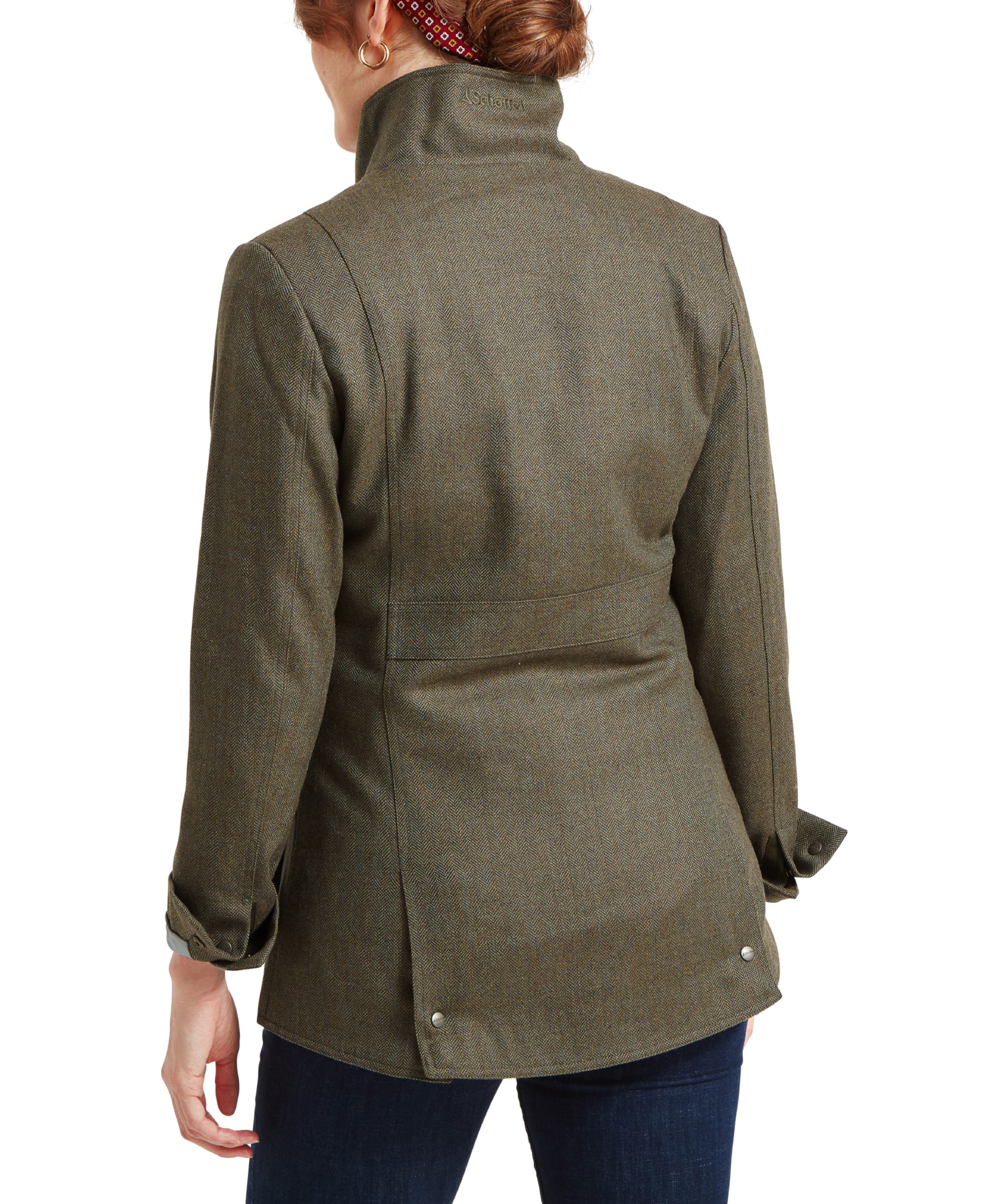 Back view of the woman in the Schöffel Lilymere Jacket for Women in Green, showing the fitted cut and buttoned rear detailing of the jacket.