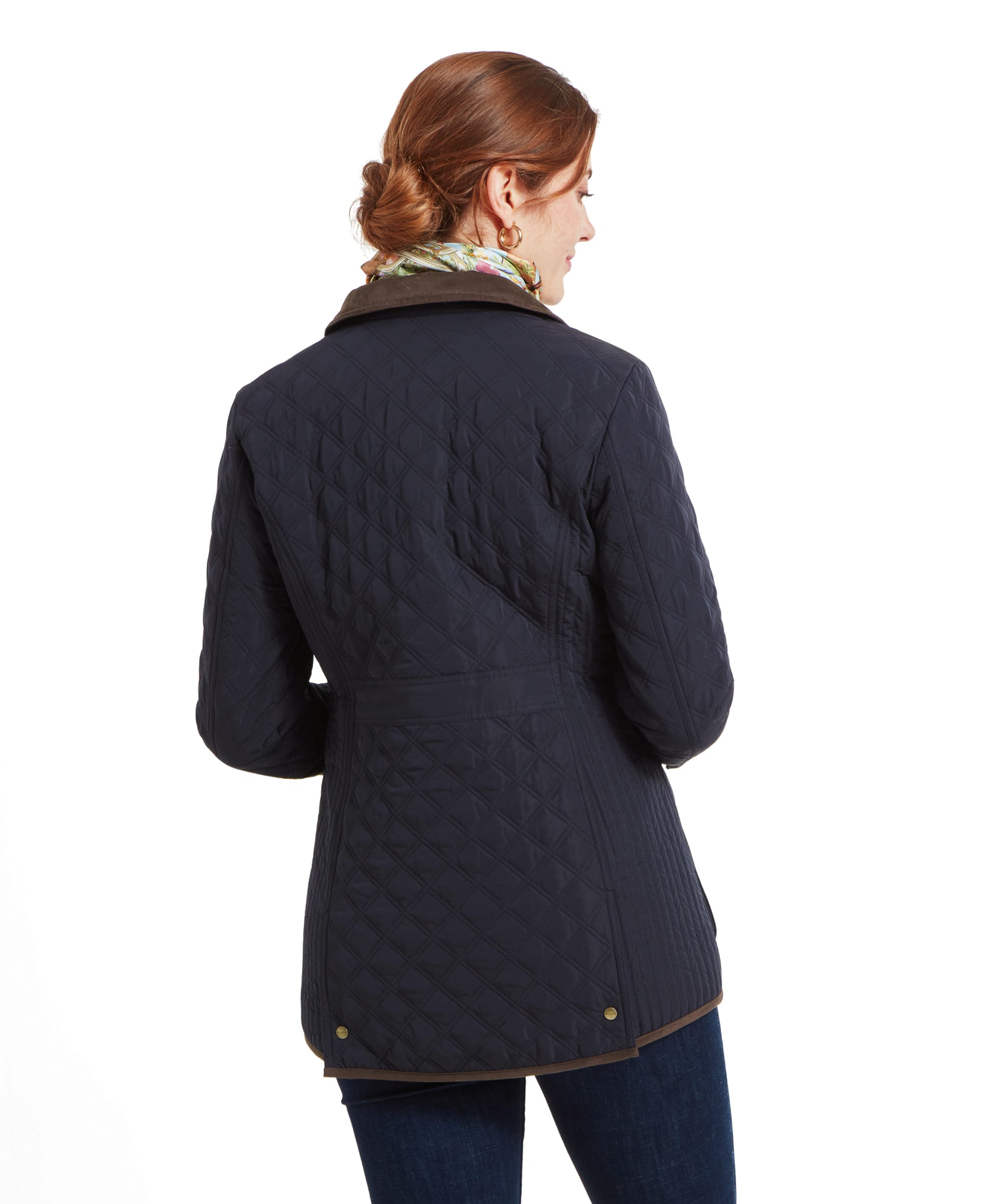 Back view of the Schöffel Lilymere Quilted Jacket for Women in Blue, displaying the diamond quilting pattern, buttoned back vents, and brown trim details.