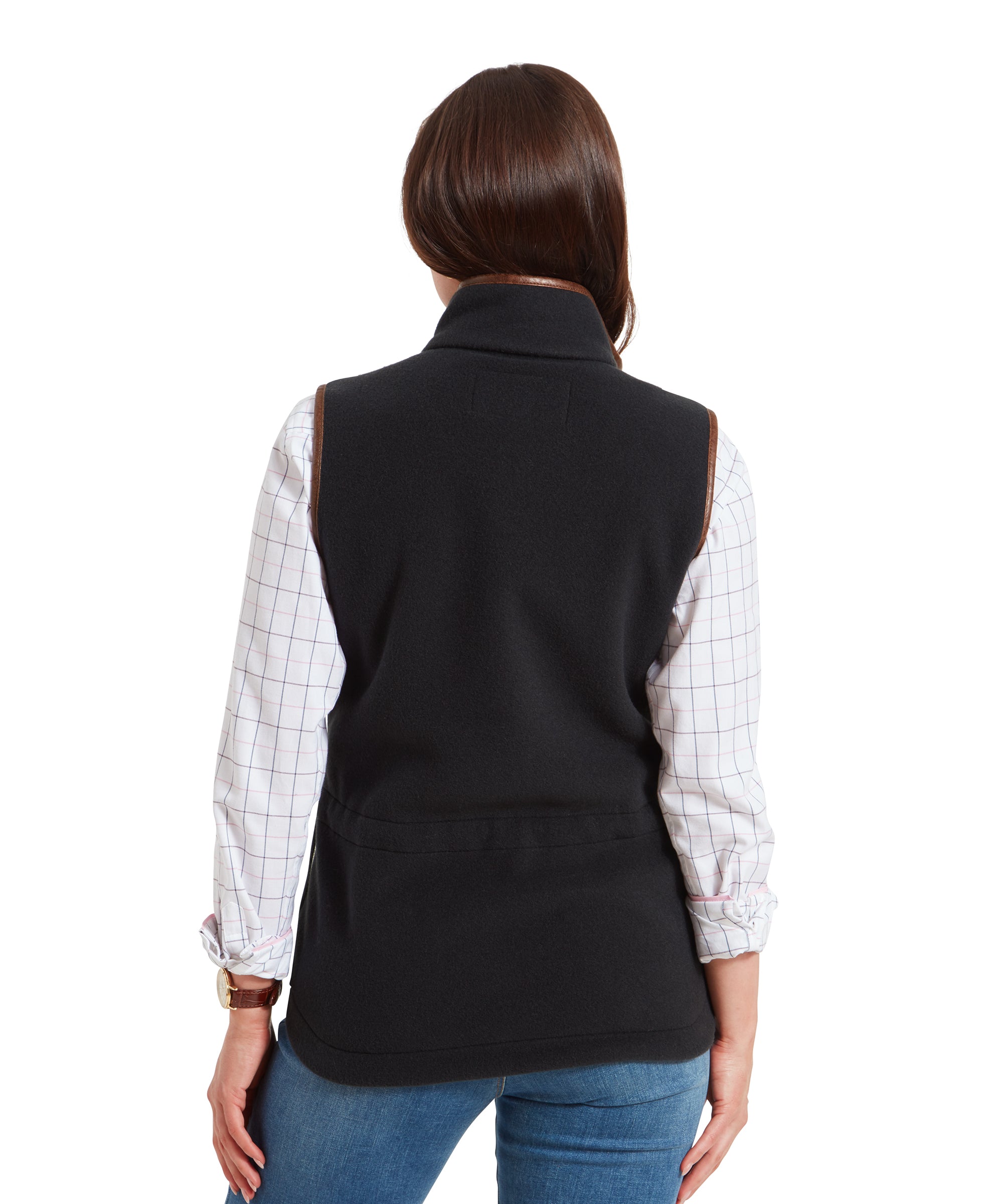 A rear view of the Schöffel Lyndon Fleece Gilet for Women in Grey, showing the back details and fit. The woman’s arms are down, and she is looking slightly to the side.