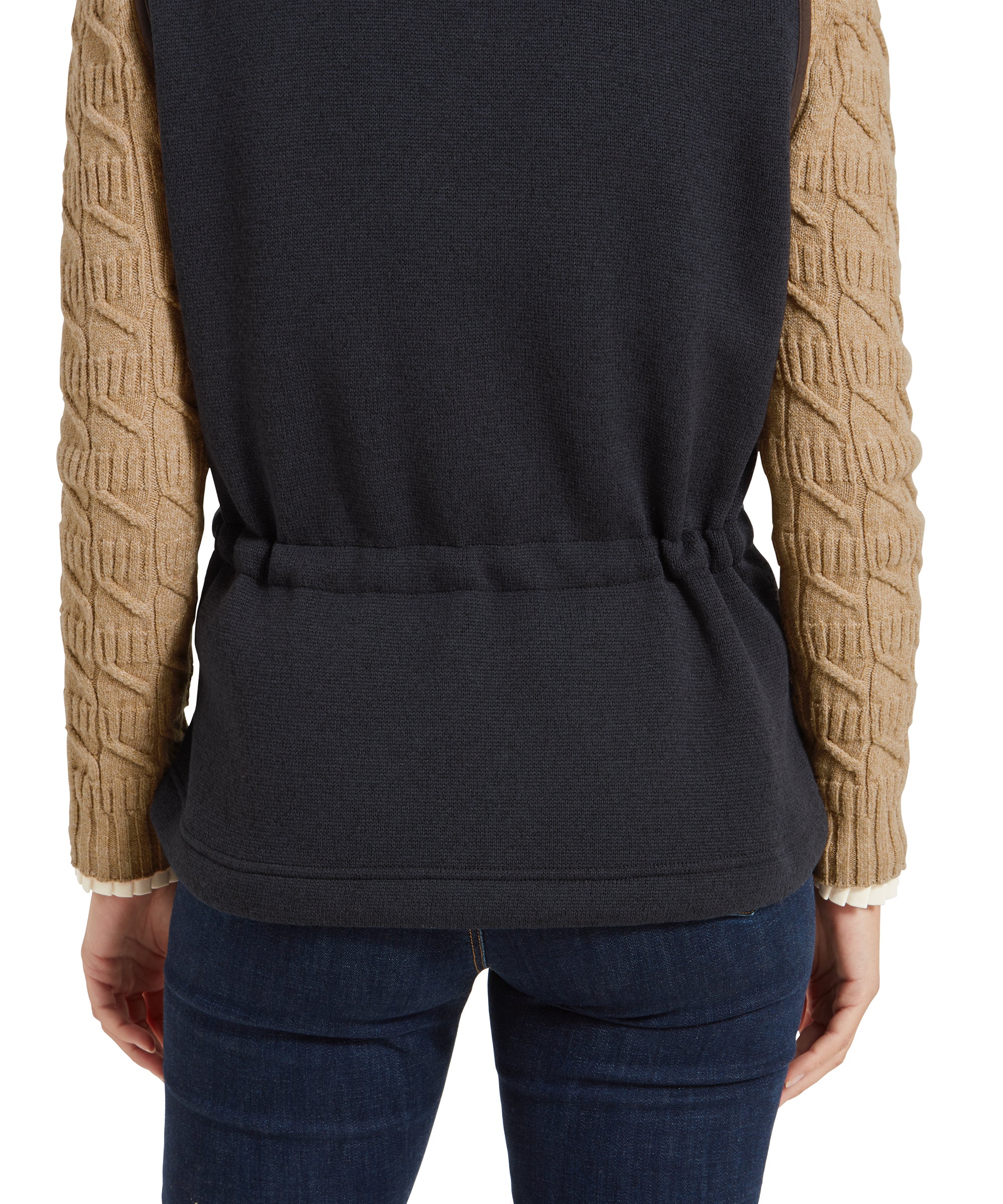 A close-up view of the back of the Schöffel Lyndon Hybrid Gilet for Women in Blue, highlighting the elasticated waist and the texture of the tan sweater sleeves.