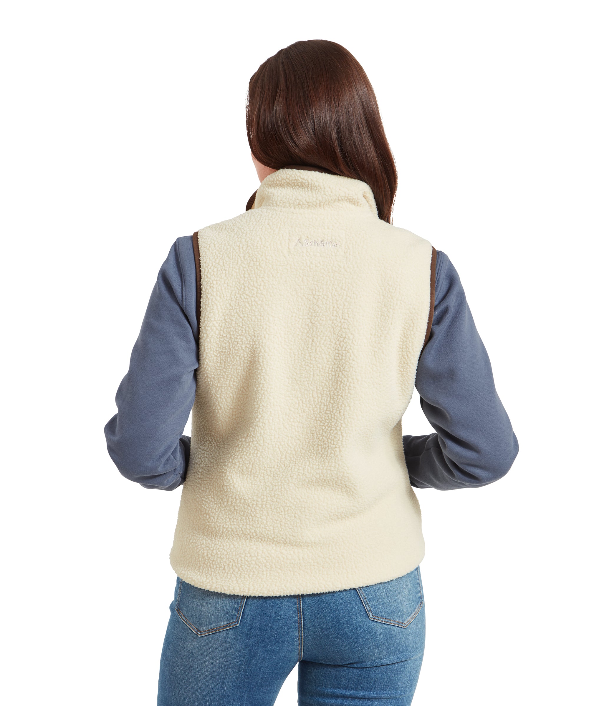 A rear view of the woman wearing the Schöffel Lyndon Retro Fleece Gilet for Women in Cream, highlighting the back design of the gilet.