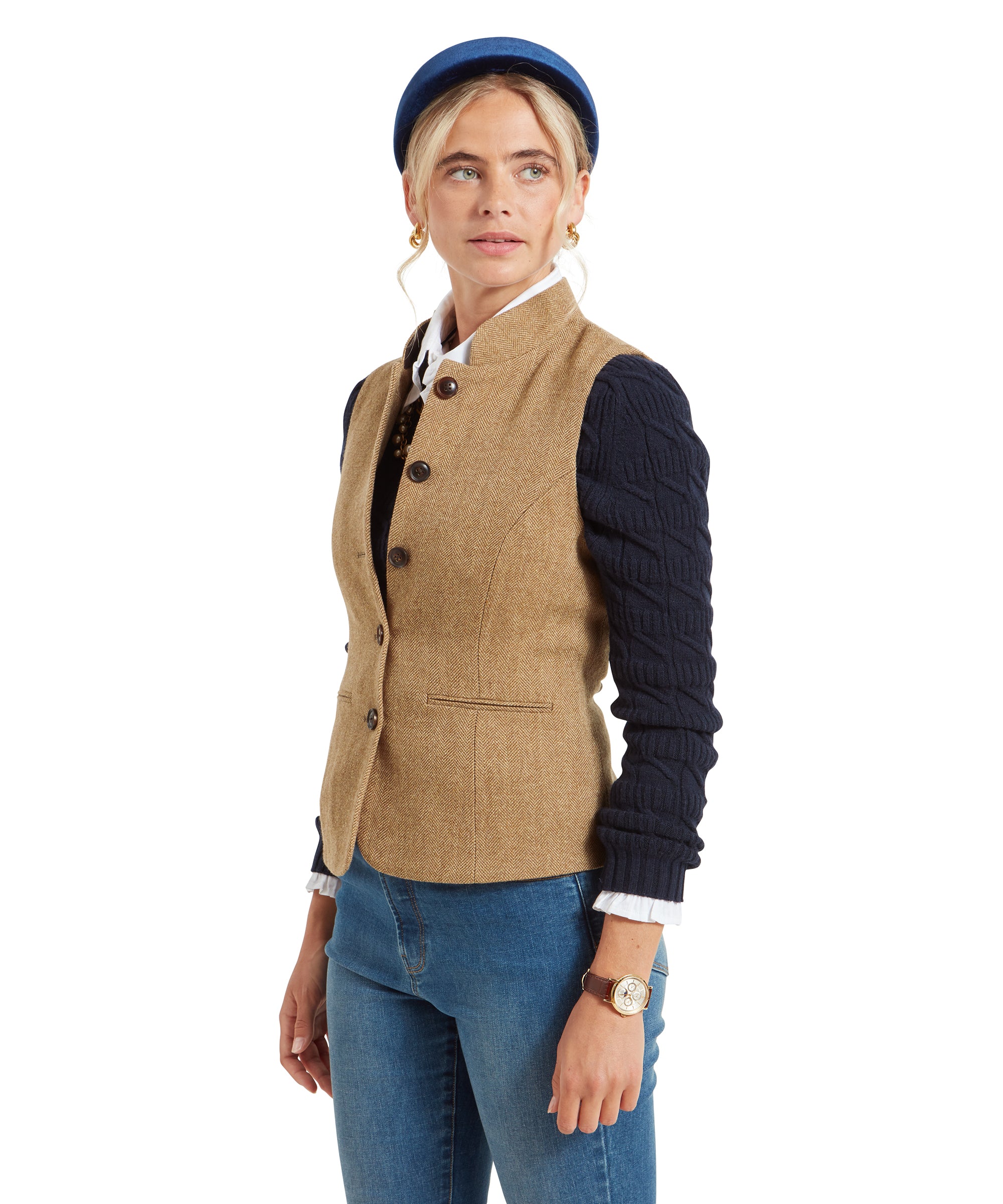 A side view of the woman in the Schöffel Millport Tweed Nehru Waistcoat for Womens in Light Brown, showing the fitted waist and button details.