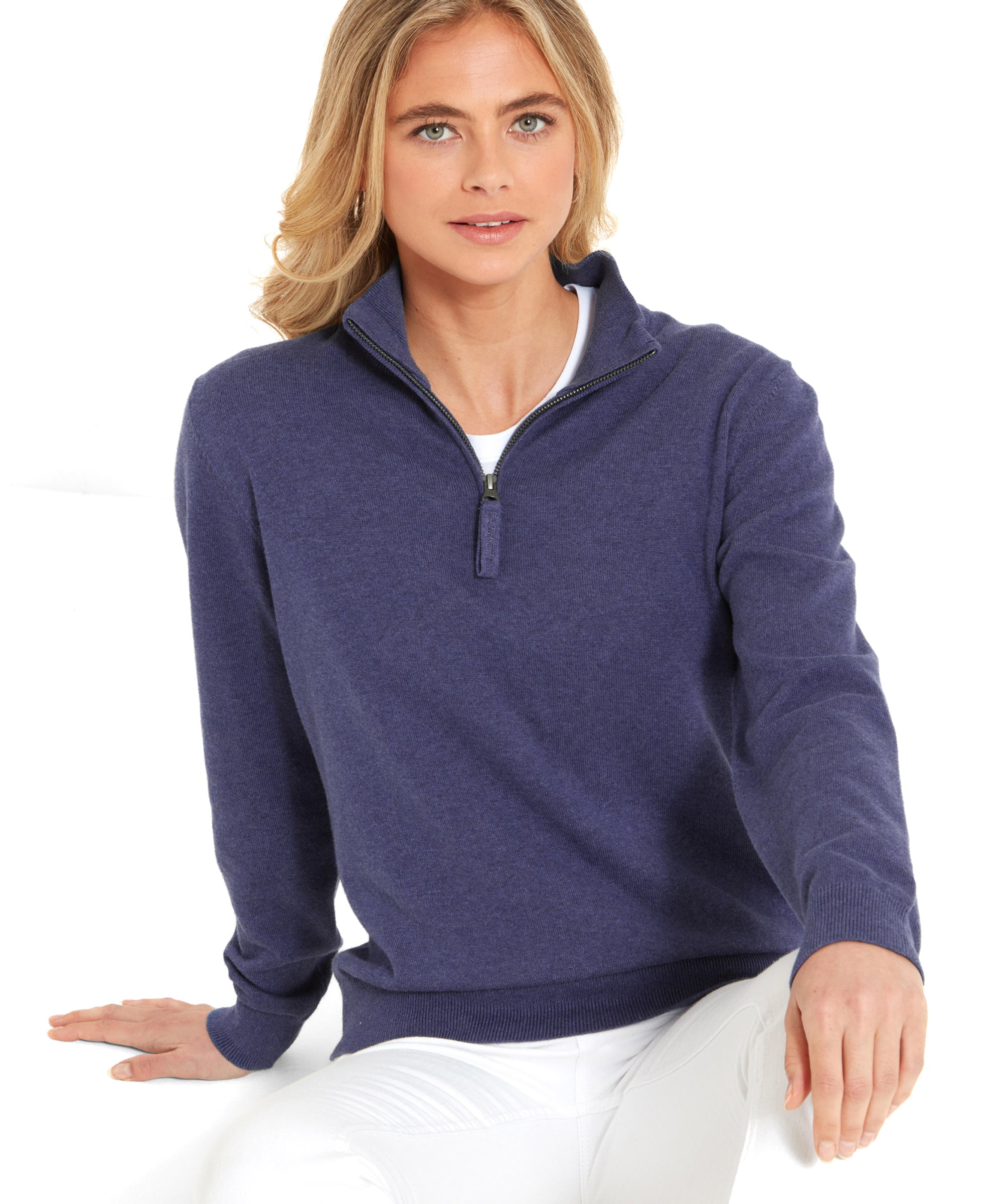 A woman in a Schöffel Polperro Pima Cotton 1/4 Zip for Women in Navy Blue sitting, looking at the camera.