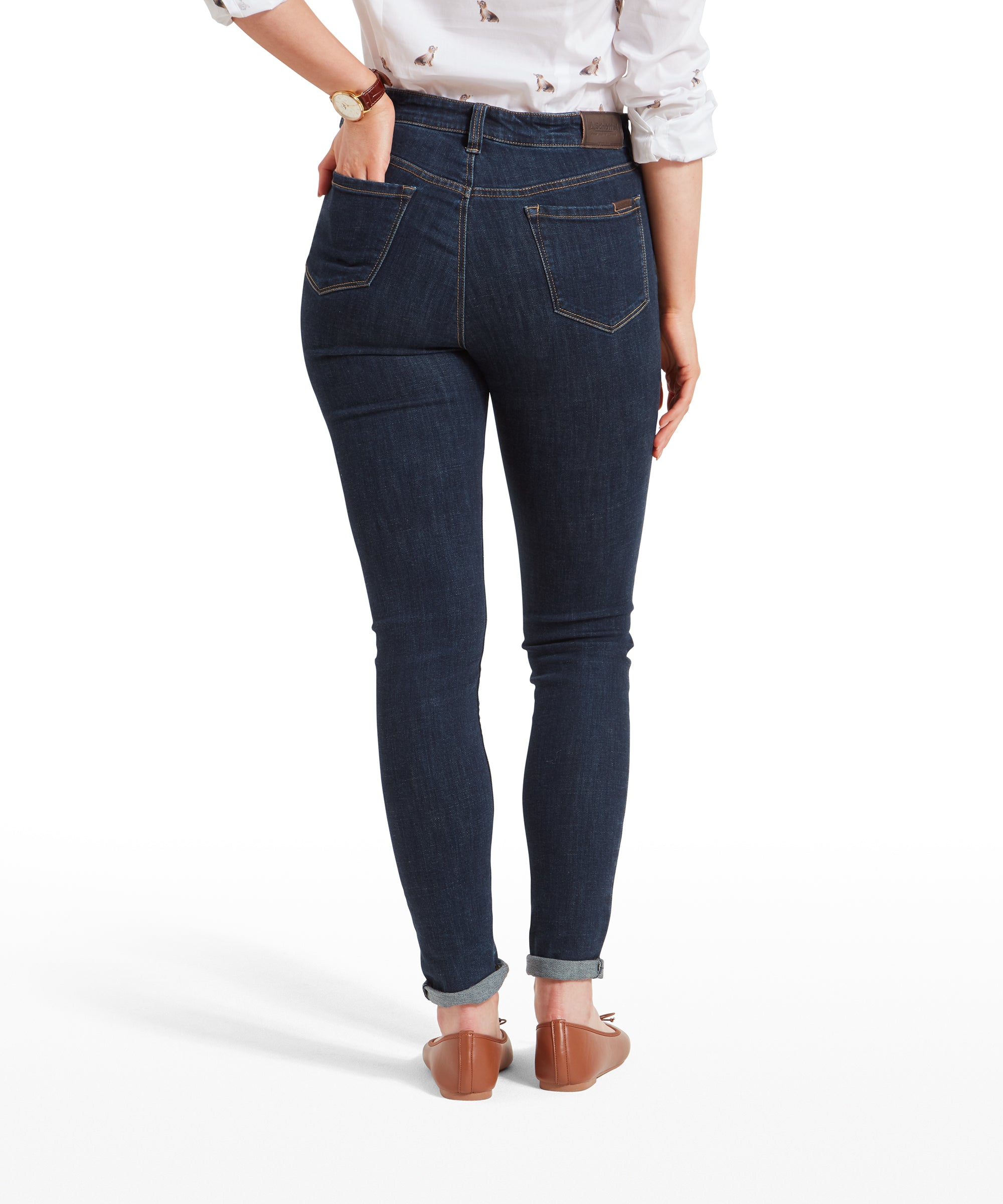 Rear view of the woman wearing Schöffel Poppy Jean for Womens in Dark Blue that have a high waist and a flattering fit. The jeans feature classic back pockets and brown stitching.