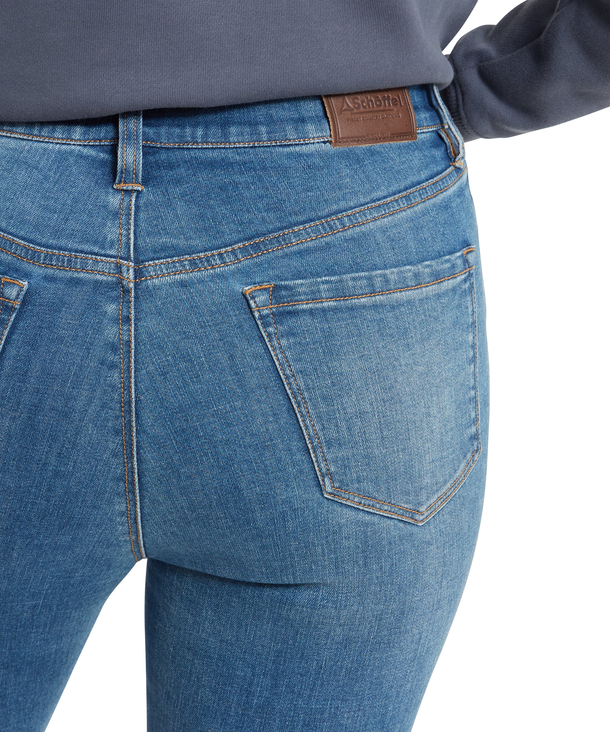 Close-up of the back pocket area of the Schöffel Poppy Jean for Womens in Blue, showing the Schöffel brand leather label on the waistband.