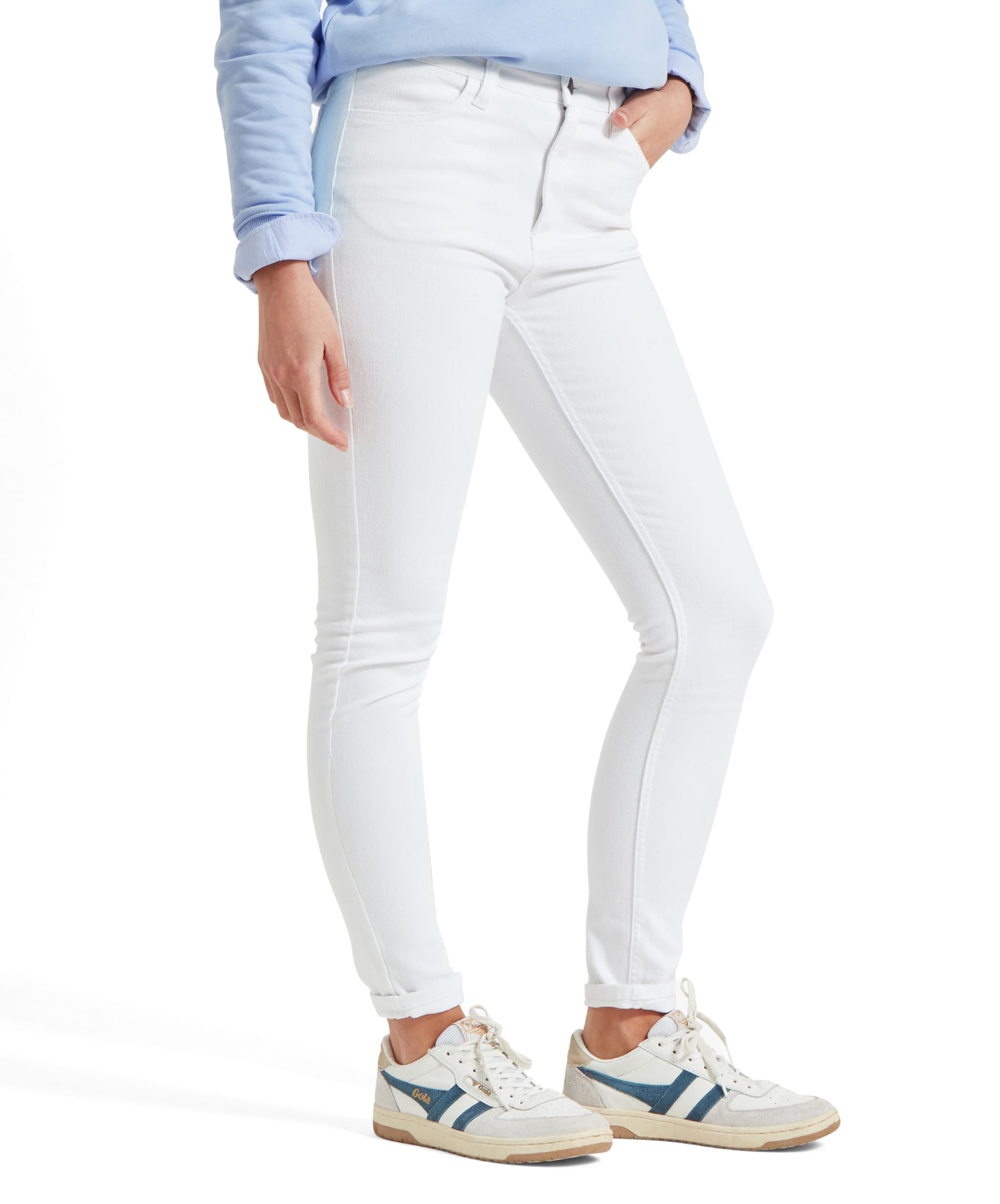 Close-up image of a woman wearing Schöffel Poppy Jean for Womens in White paired with white trainers. The jeans are high-waisted and fitted through the leg, showing a clean, crisp appearance.