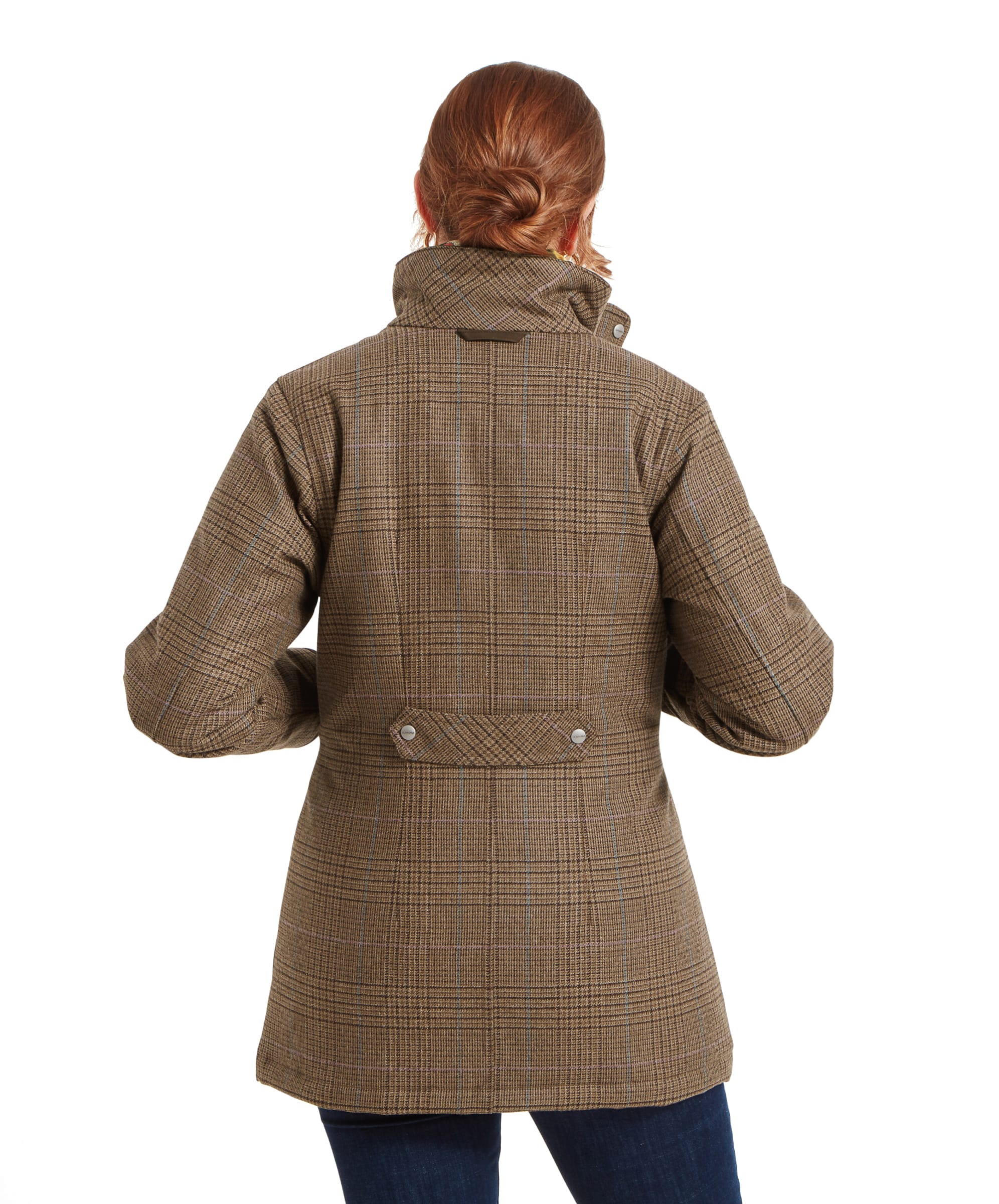 Back view of a Schöffel Ptarmigan Tweed Coat for Women in Brown worn by a woman. The coat features a buttoned belt detail at the back and a high collar, adding a touch of sophistication to the outfit.