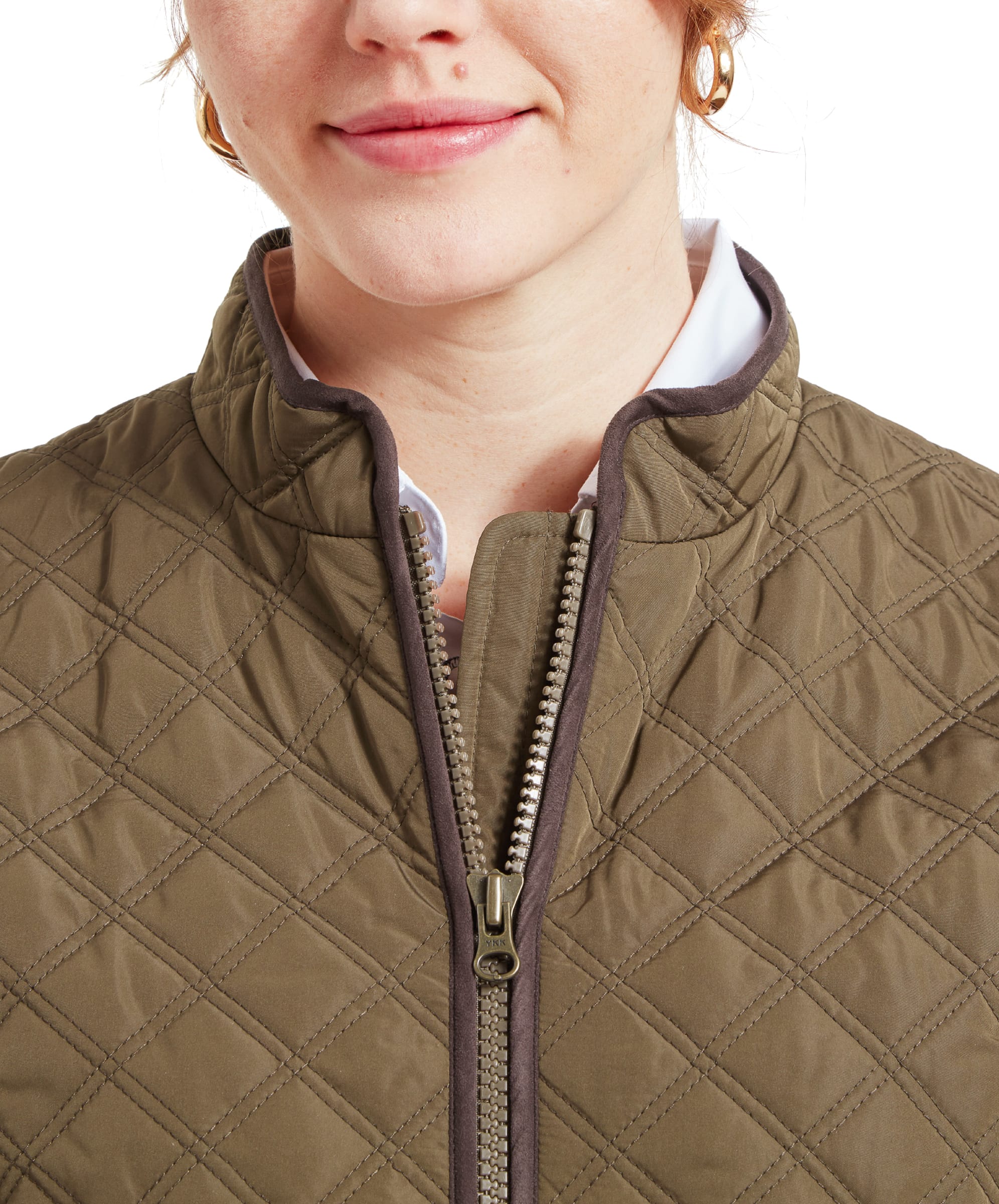 Close-up of the upper chest area of a woman wearing a Schöffel Quilt Gilet for Women in Green, highlighting the high collar and zipper detail.