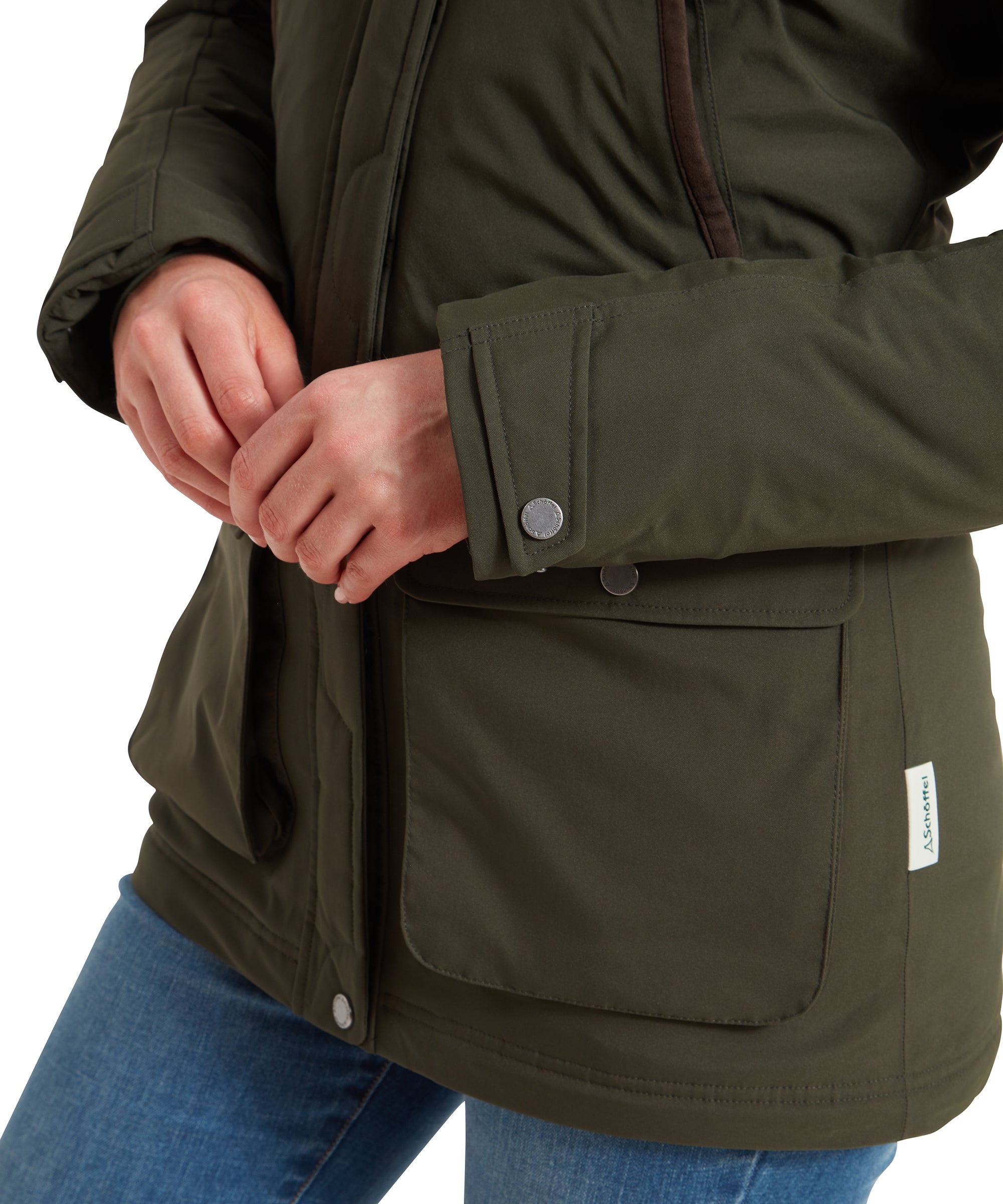 A close-up of the Schöffel Rockingham II Coat for Women in Green's cuff, highlighting the button and stitching details.