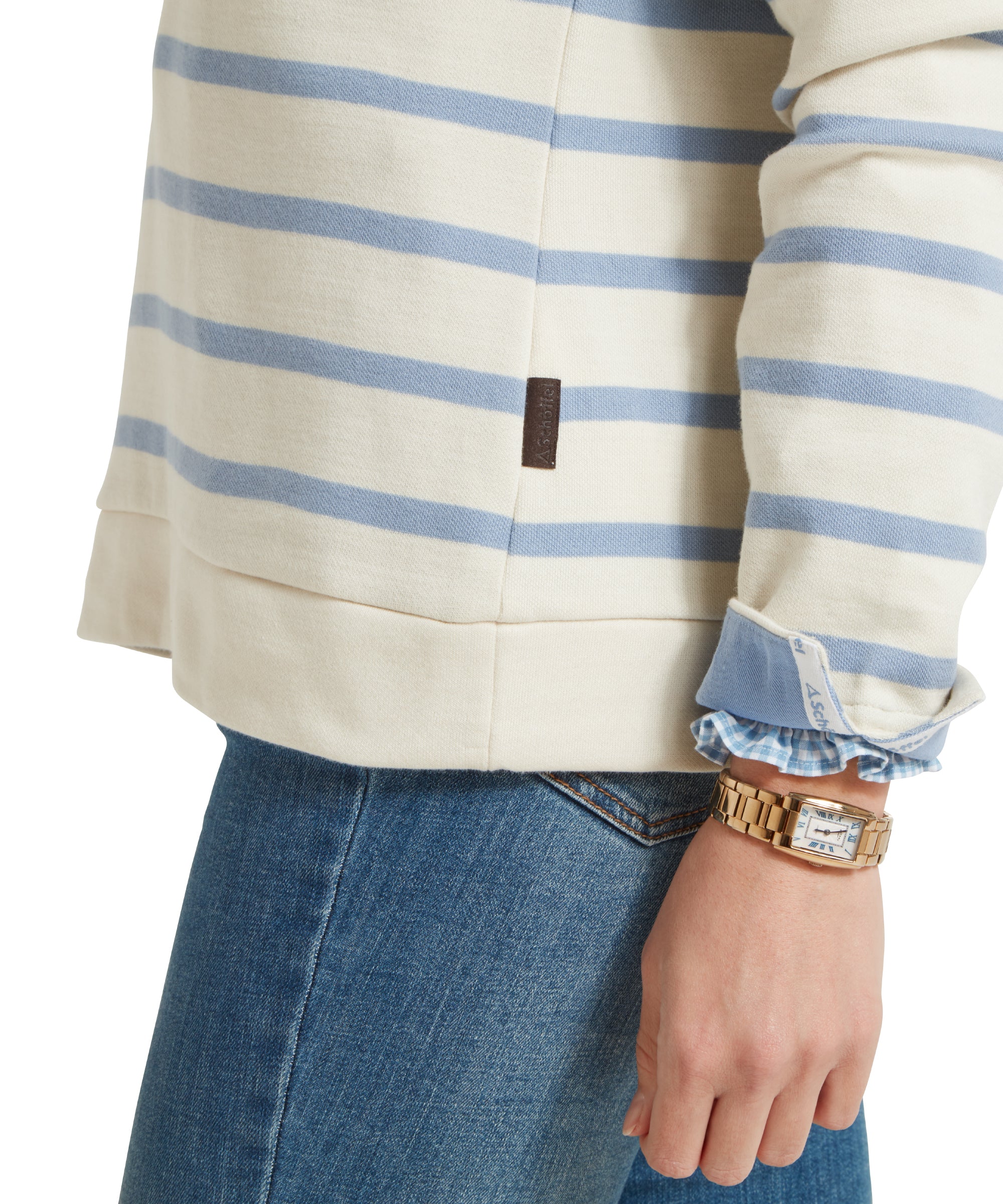 Close-up of turned up sweatshirt cuff of a blue and beige Schöffel sweatshirt.