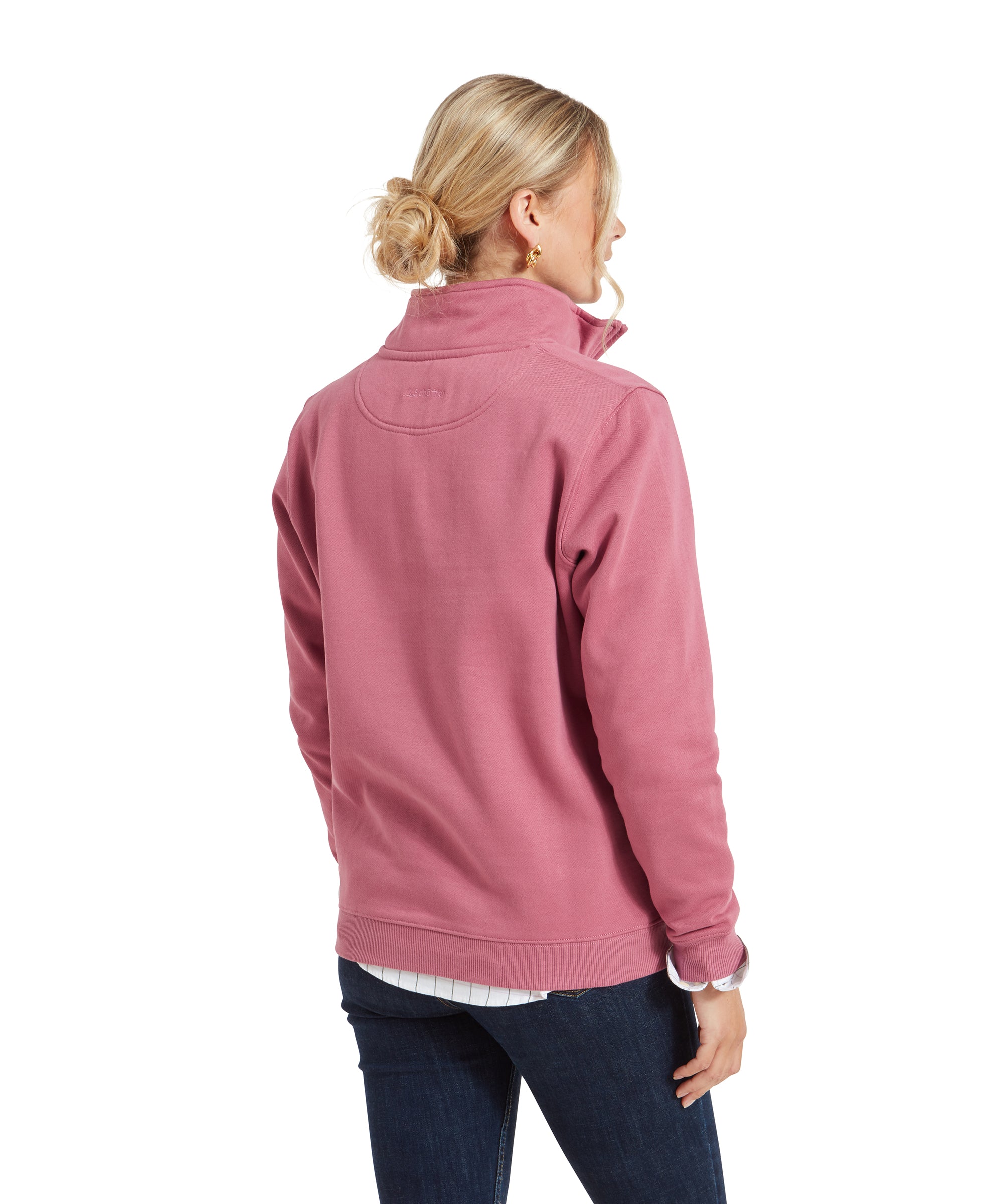 Rear view of the woman wearing the Schöffel Sennen Cove Sweatshirt for Womens in Pink, highlighting the back design and the slightly relaxed fit.