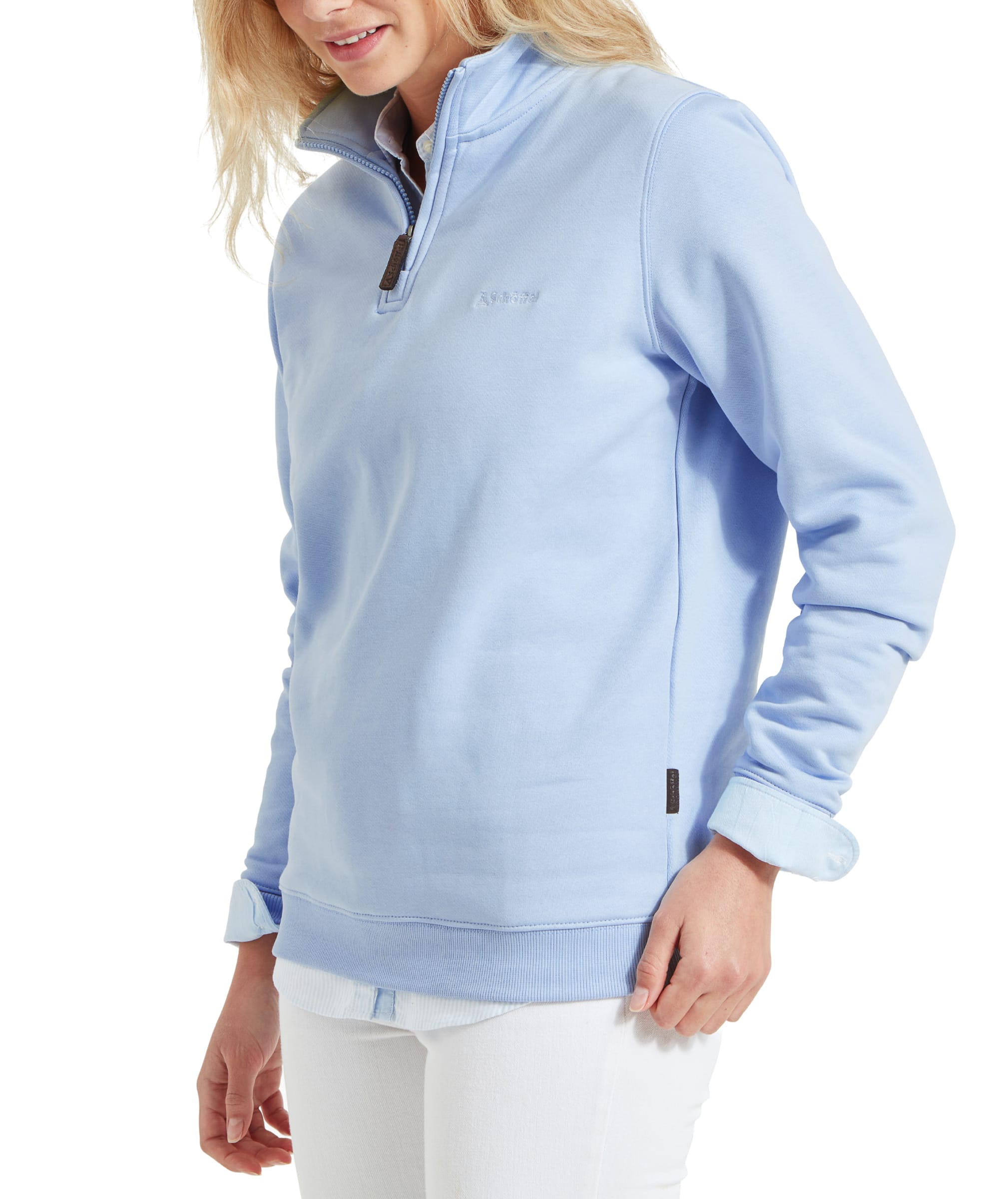 Close-up side view of the woman wearing the Schöffel Sennen Cove Sweatshirt for Womens in Blue. The focus is on the front and sleeve details of the sweatshirt.