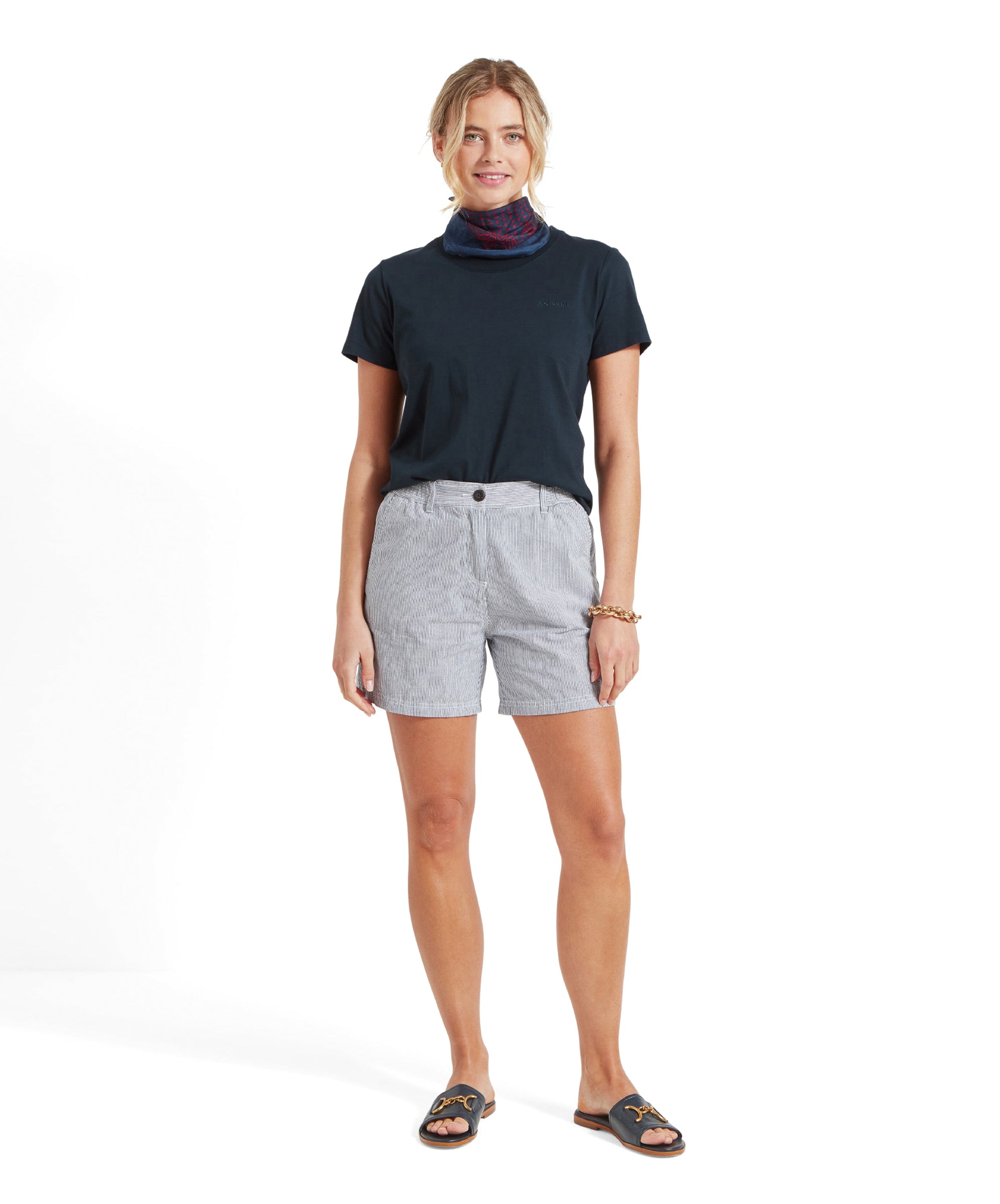 Another full view from a different angle of the woman in the Schöffel Tresco T Shirt for Women in Navy and striped shorts.