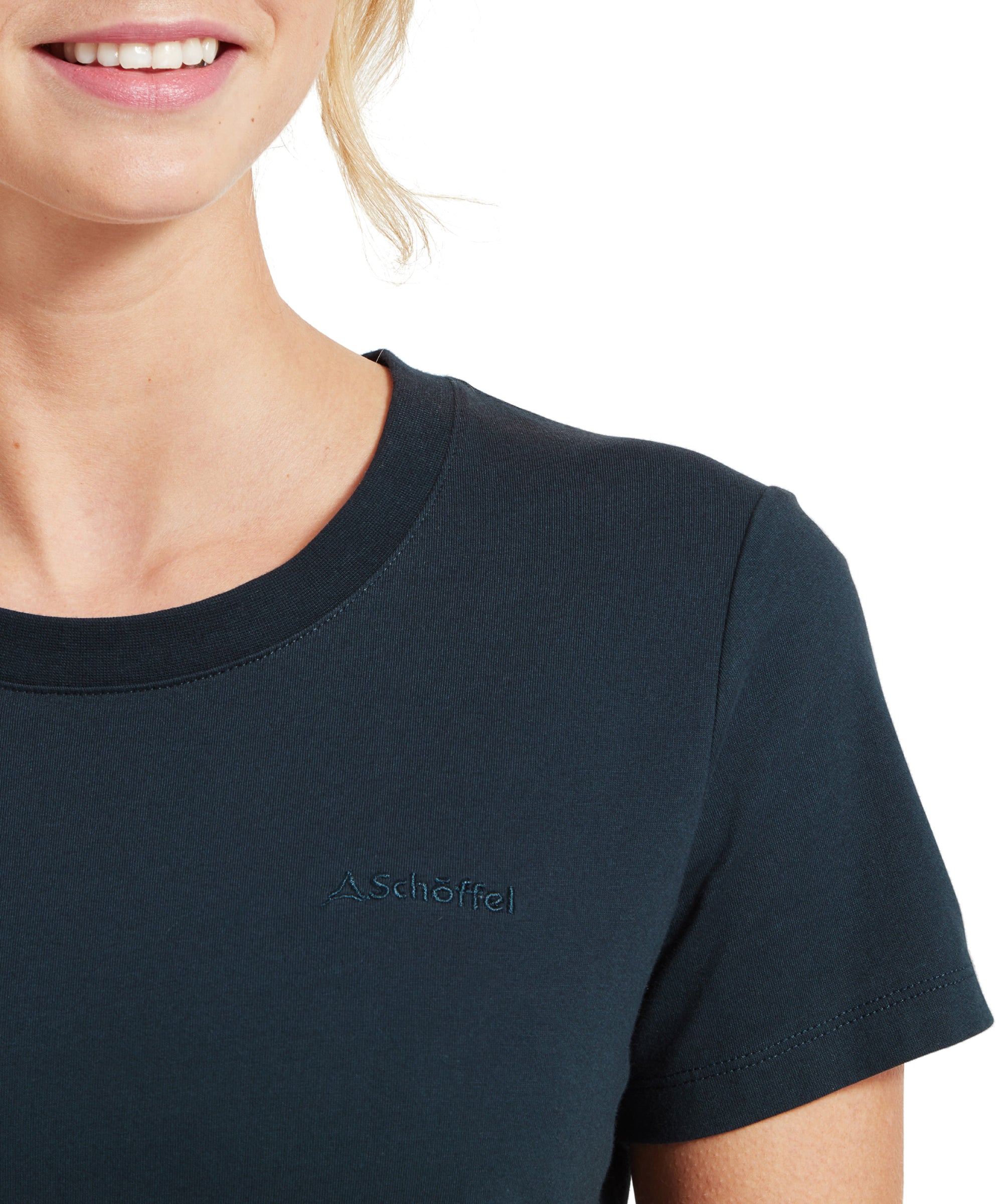 Close-up of the collar and logo of the Schöffel Tresco T Shirt for Women in Navy.