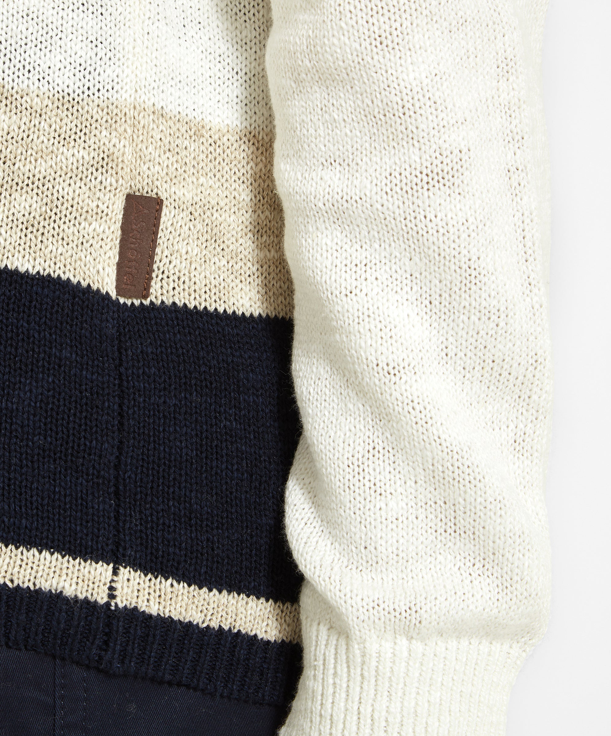 Close-up of the sleeve detail of the Schöffel Treyarnon Bay Jumper for Women in Light Brown, highlighting the texture and the small brown logo tag.