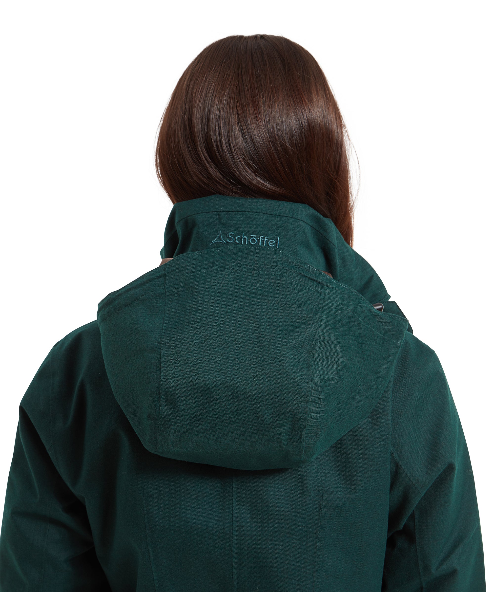 A close-up of the Schöffel Wakerley Jacket for Women in Green's hood visible at the back of the collar. The hood sits folded within the collar pocket and can be stowed away when not required.