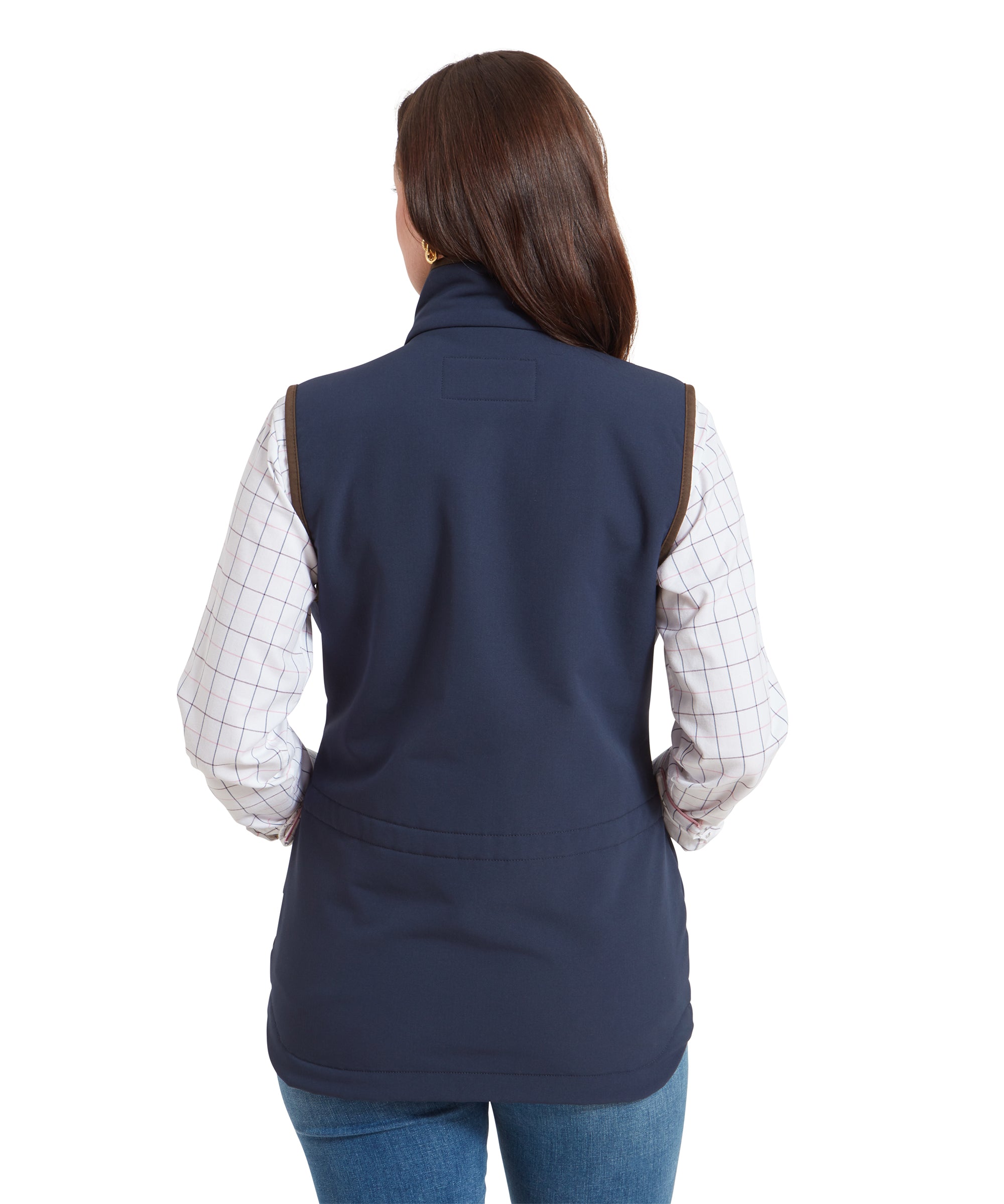 The back view of the woman wearing the Schöffel Belton Gilet for Women in Navy, showing the fitted design with slight gathering at the waist.